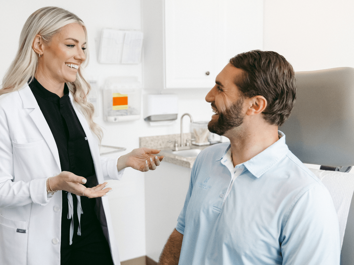 dermatologist talking to a patient